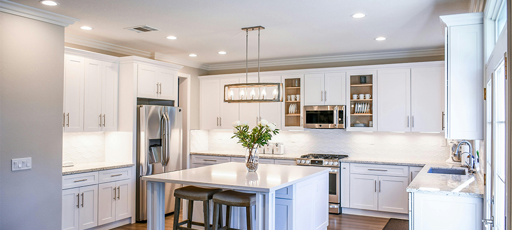 A well-lit small kitchen with under-cabinet lighting for a modern touch