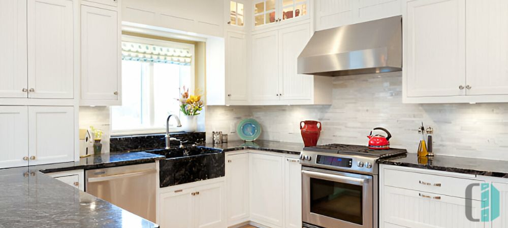 Sleek kitchen cabinets with chrome finishes, offering a contemporary look with a touch of shine