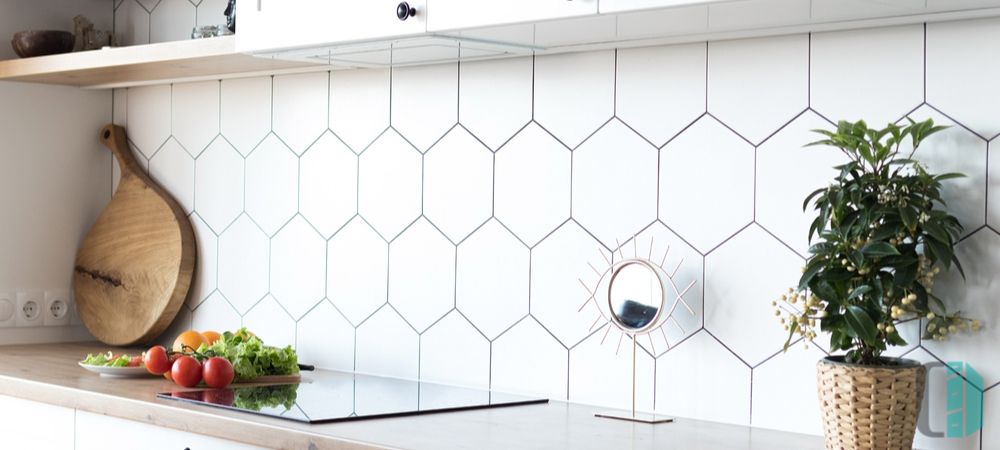 Modern kitchen featuring a geometric tile backsplash, creating a visually striking pattern